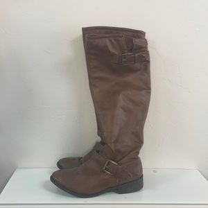 Knee high boots with red zipper